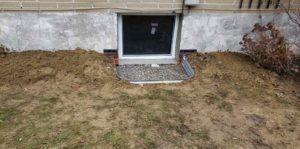 wet basement window well 